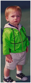 Lost little boy in green jacket